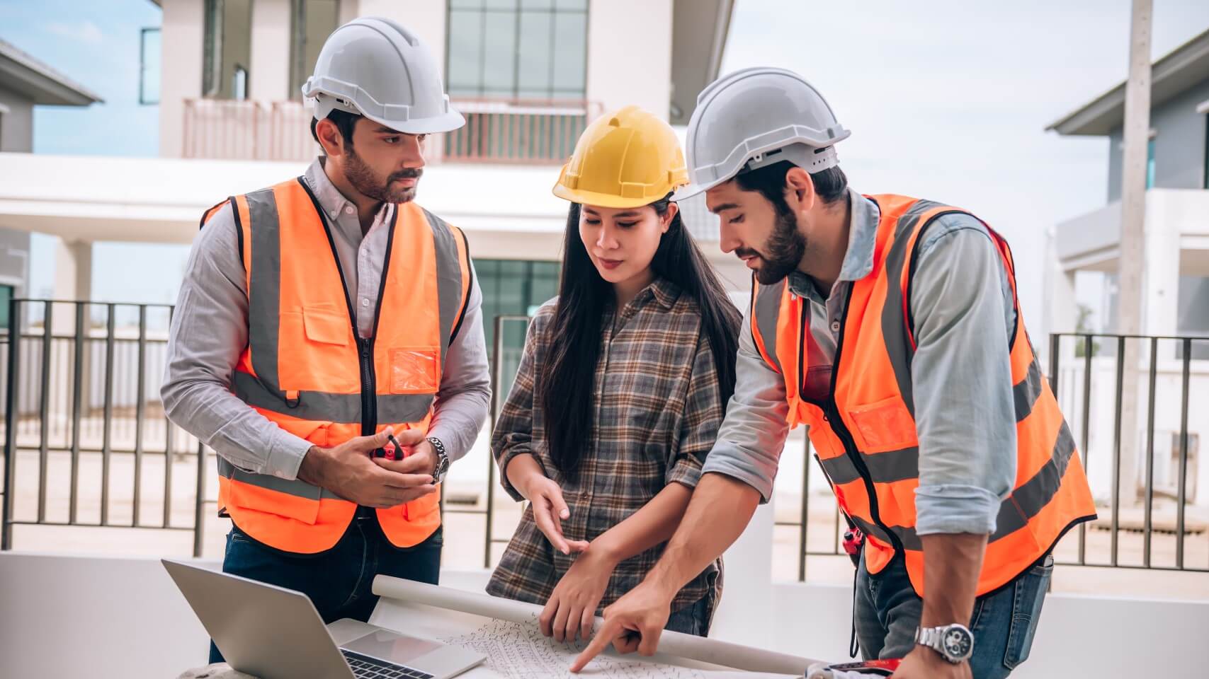 civil-engineer-construction-worker-architects-wearing-hardhats-safety-vests-are-working-together-construction-site-building-home-cooperation-teamwork-concept (1)